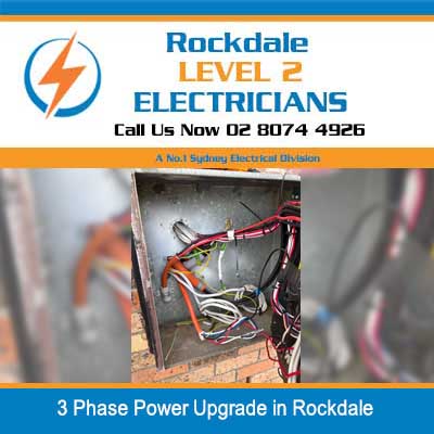 Close-up of three-phase electrical wiring and connections inside switchboard in Rockdale