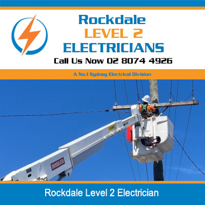 Level 2 electrician in cherry picker working on power lines in Rockdale